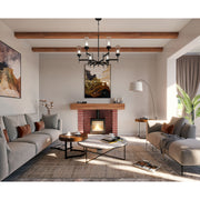 Modern living room with gray sofas, a fireplace, and decorative elements.